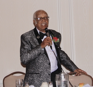 Larry Wilson holds microphone